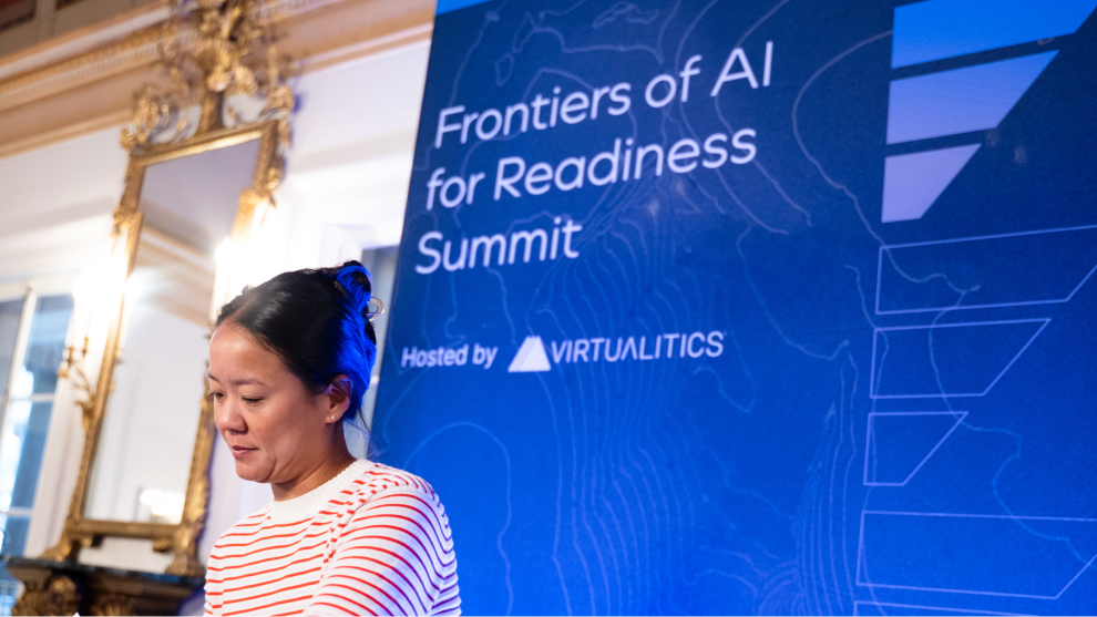 FAR summit speaker with Frontiers of AI Catalysis branded slides in the background