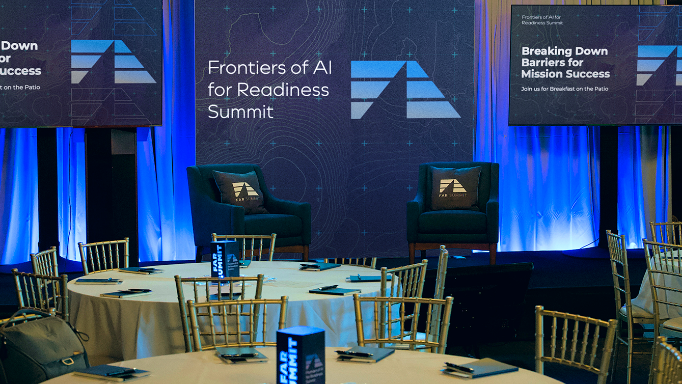 FAR Summit event tables and banners in the background