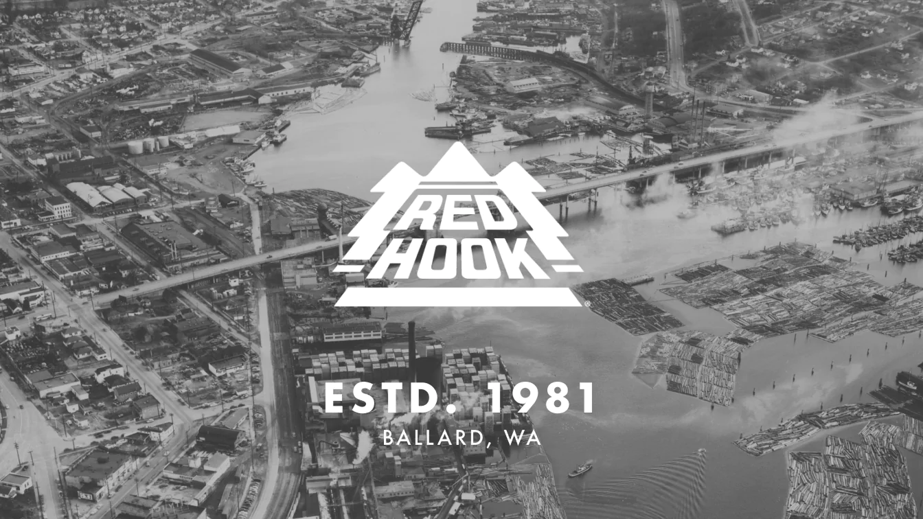 Black-and-white aerial view of Ballard, WA, with the Redhook Brewery logo and "ESTD. 1981" text overlayed.